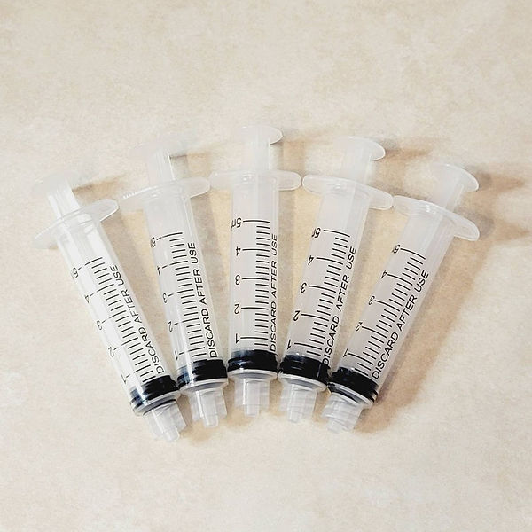 Adhesive Syringe