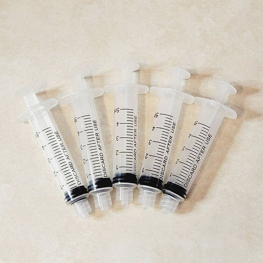 Adhesive Syringe